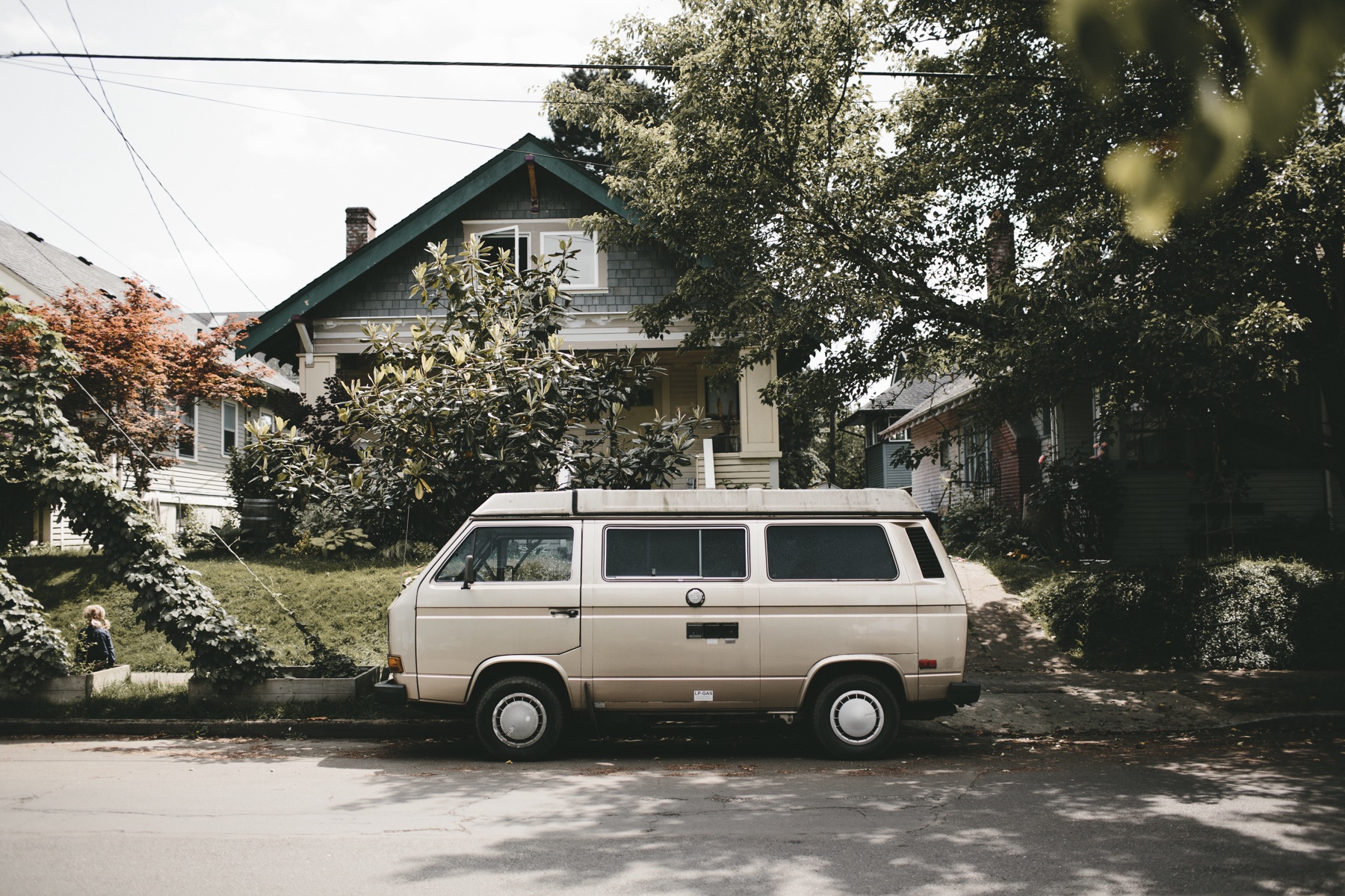 a car sists outside a building with home insurance.