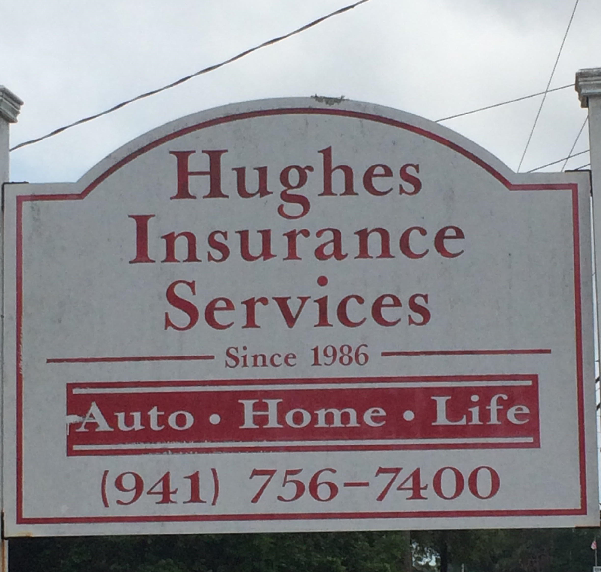 A sign reads: Hughes Insurance Services. Auto, Home, Life. 941-756-7400. Get insurance in Bradenton.
